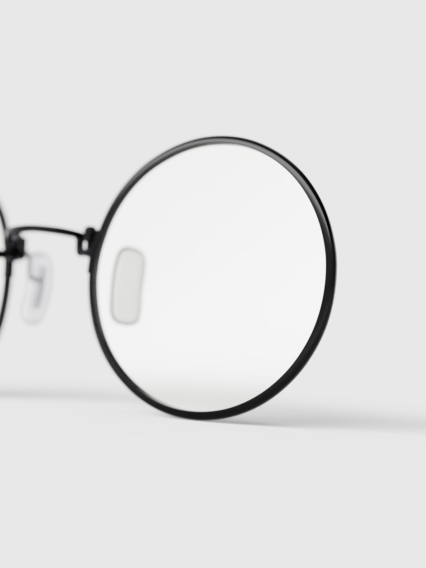 Glasses' right lens detail